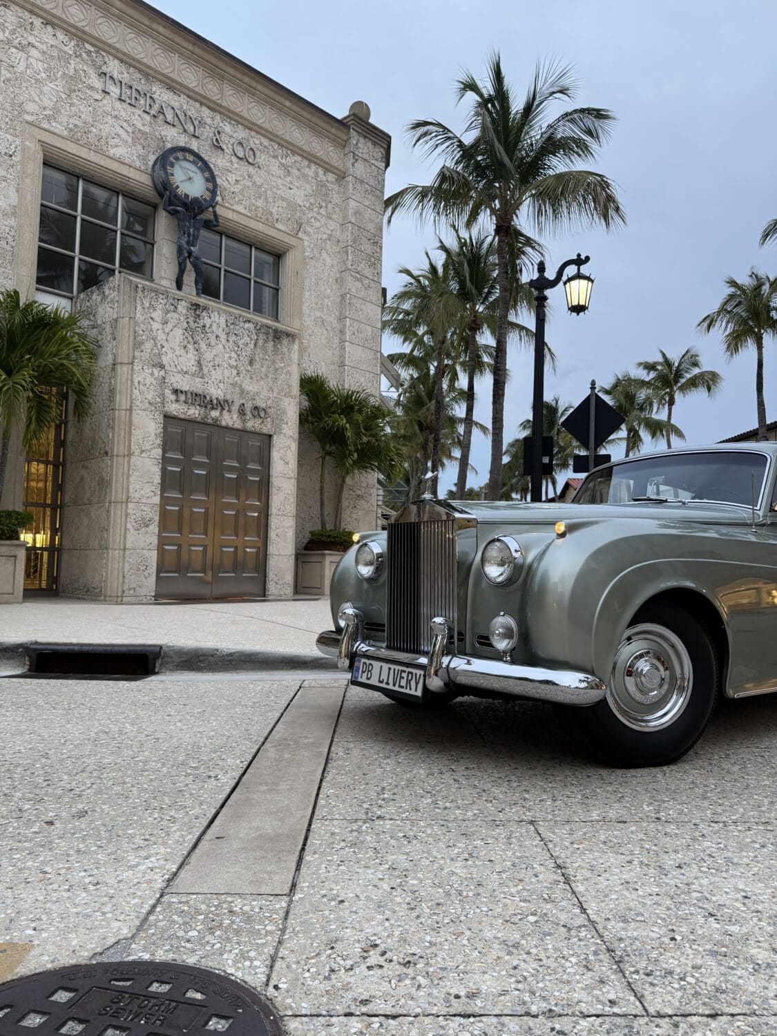 It was ordered on June 3, 1959 by Jay Kasler, VP of the Free Sewing Machine Co. in Beverly Hills, through the Rolls-Royce dealer Peter Satori of California at a cost of $19,681. The car was loaded with options, including full front and rear air conditioning, power steering, electric windows, rear seat vanities, rear radio controls, and the special sheepskin mouton overlay for the rear passengers. History & Provenance Jay Kasler, the son of Russian immigrants, built an impressive life in California. After starting several companies, he and some friends founded City National Bank in Beverly Hills in 1954 — he was its first Chairman of the Board. This Silver Cloud was driven for nearly 15 years almost exclusively by the family’s longtime chauffeur, Raymond Russell Jones, who had been with the Kaslers since 1940 (except for his time in the U.S. military during WWII). Mr. Jones was the only person behind the wheel until his retirement. The car stayed in the family the entire time. In 1988, Mrs. Kasler’s daughter, Mrs. Alex Roger, inherited it and invested approximately $25,000 in a careful restoration — repainting it in its original Shell Grey, refinishing the wood, updating the interior, and performing many mechanical improvements. After she passed, it went to her son and then to her great-grandson, who still cares for it today. The service records have been kept meticulously since new and come with the car. It’s hard to imagine better provenance than this.